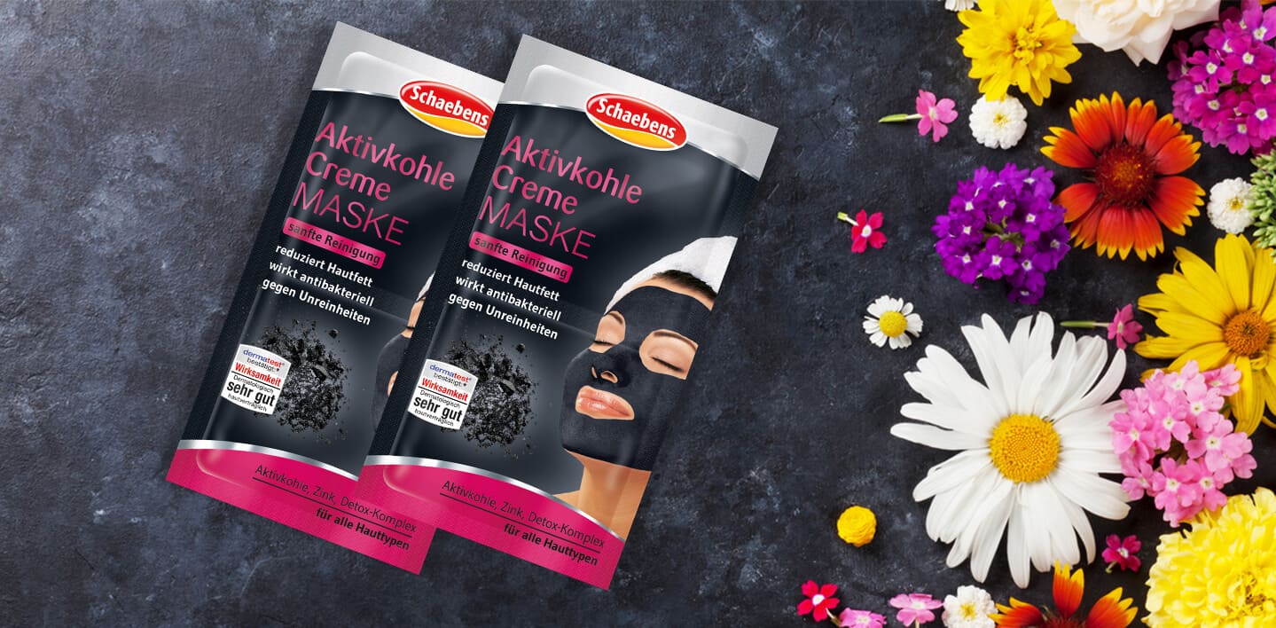 aktivkohle-creme-maske-gesichtspflege-pflege-gesichtsmaske-maske-schaebens-zink-detox-komplex-antibakteriell-verfeinert-reinigend-schützt-regeneration-sanft-header-schwarz-pink-blumen
