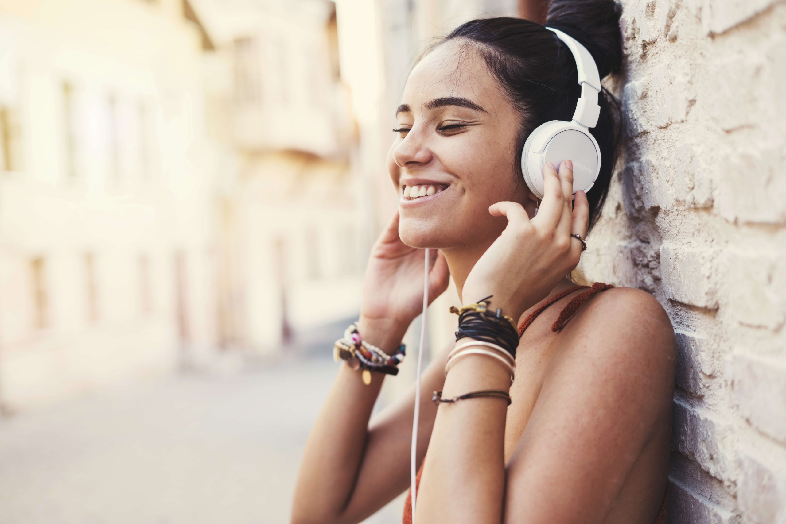 Beautiful young girl listening music